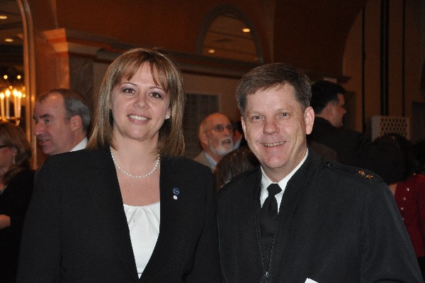 Jennifer Kauffman, chapter president, thanks the January luncheon speaker Rear Adm. David G. Simpson, USN, vice director of the Defense Information Systems Agency.